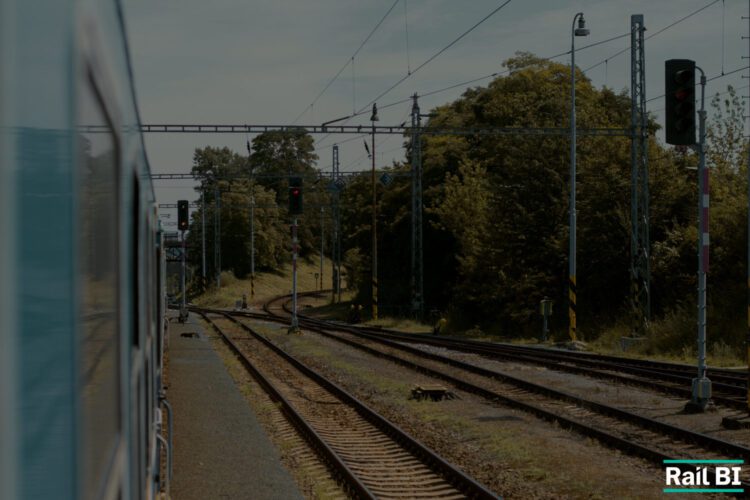 Image of a train going past a rail signal to signify the update to digital signals as part of ETCS rollout